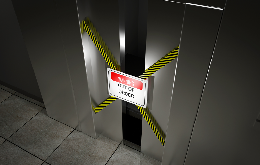 Stainless steel elevator doors taped shut with yellow caution tape and an "Out of Order" warning sign.